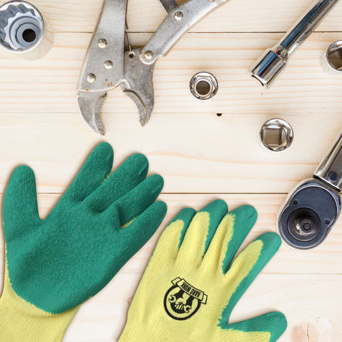 Latex dipped gloves in green and yellow, placed on a wooden surface alongside various tools.