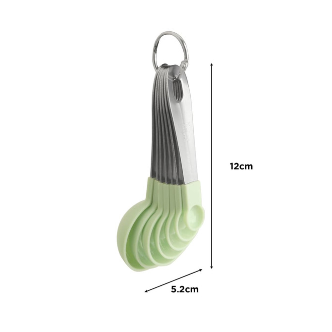 A set of measuring spoons in pastel green with a stainless steel ring for easy storage.