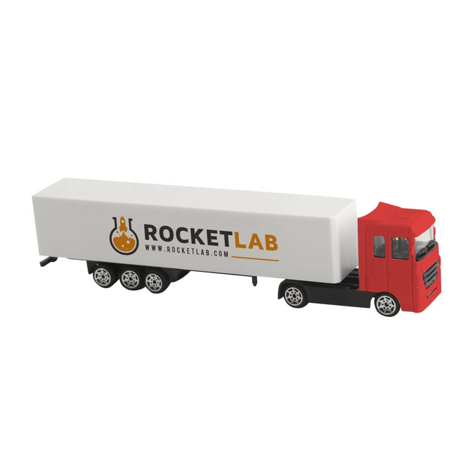 A red and black toy truck with a white trailer featuring a logo.