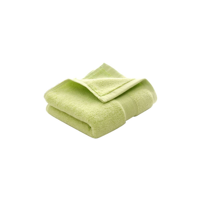A folded embroidered cotton hand towel in a soft lime green shade, featuring a textured finish and a logo.