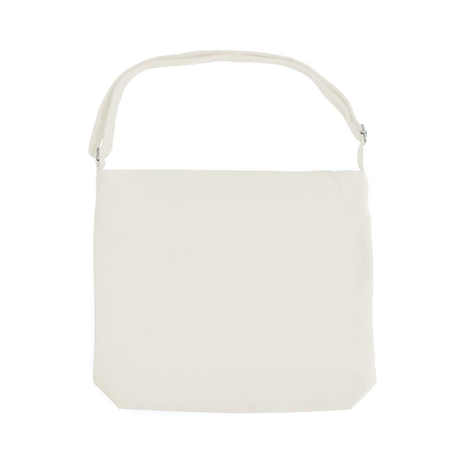 A cream canvas tote bag with a long strap and a subtle branding logo.
