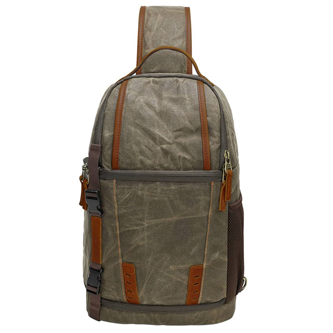 A waxed canvas camera sling bag in olive green with brown leather accents and a padded shoulder strap.