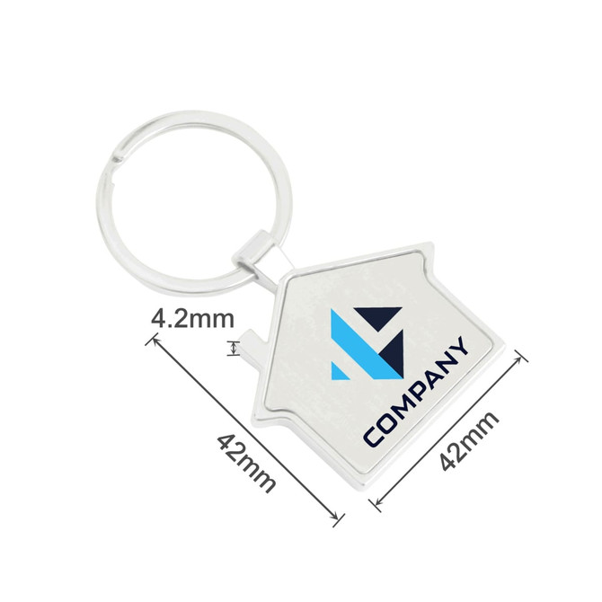 A silver house-shaped metal keyring with a circular attachment and a logo. Dimensions are 42mm by 42mm.