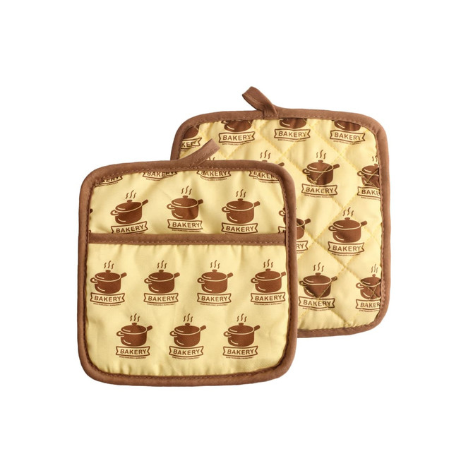 A pair of large quilted pot holders in yellow with brown bakery-themed prints and a branding logo.