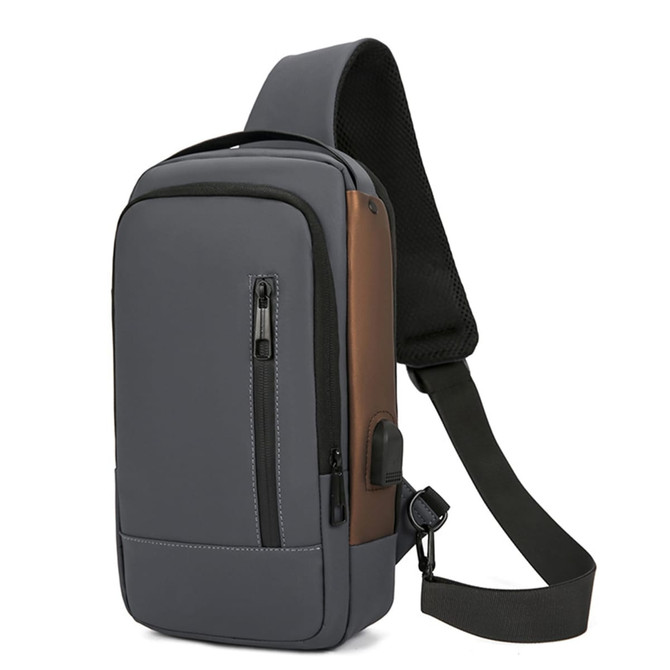 A grey and brown anti-theft sling bag with a zippered pocket and adjustable shoulder strap. It features a logo.