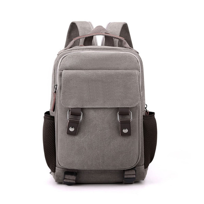 A grey canvas sling backpack with adjustable straps, side mesh pockets, and a front pocket. It features branding.