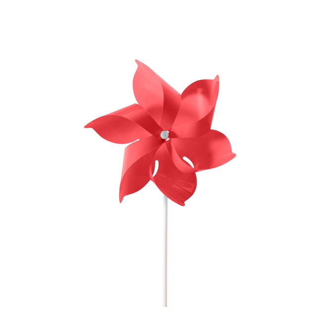 A red six-leaf pinwheel with a white stick, featuring cut-out designs in the leaves and a central hub.