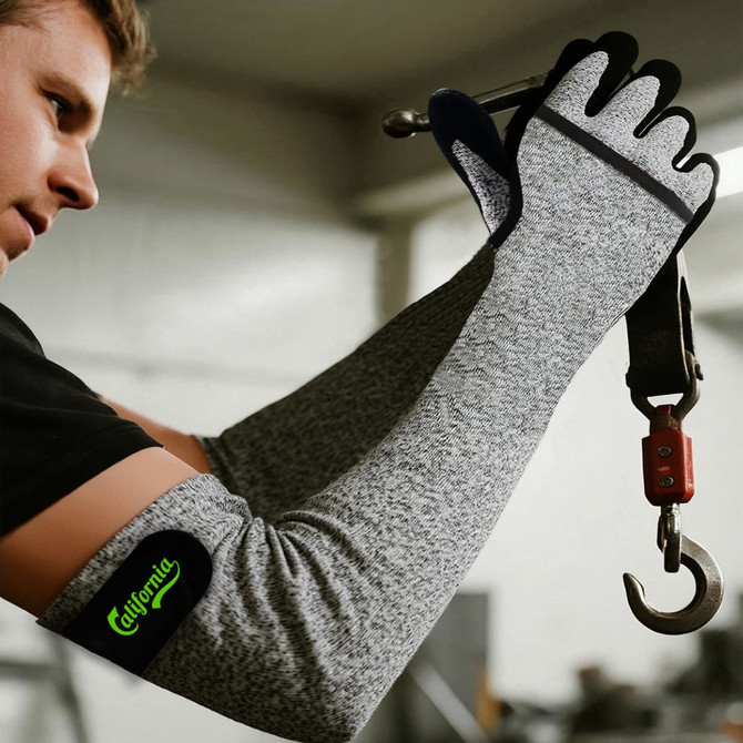 Cut resistant sleeves in grey being worn by a person, featuring a logo and a black and grey design.