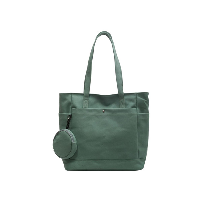 A casual canvas bag in green with two handles and a removable round pouch attached.