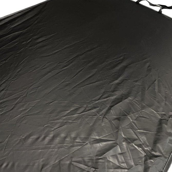 A light-blocking car sunshade in black with a textured surface, featuring straps for attachment.