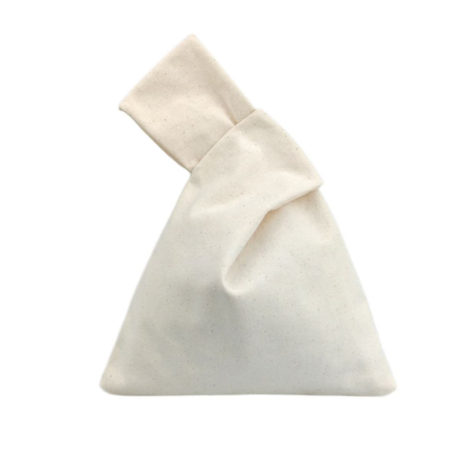 A cream-coloured cotton wrist bag with a unique folded design, featuring a logo.