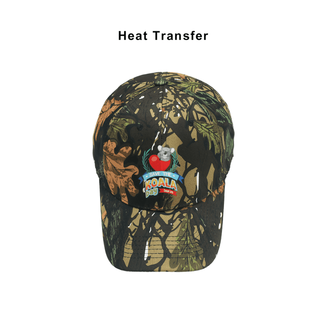 A 6-panel cap in true timber camouflage with a logo and a koala design. Features shades of green, brown, and black.