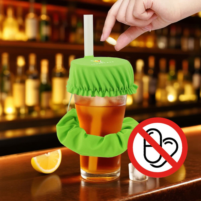A drink bottle covered with a green scrunchie cap and a matching scrunchie base, featuring a straw.