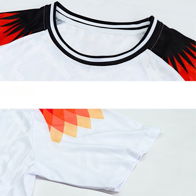 A breathable crew neck raglan tee shirt featuring red and black accents with a white body and a subtle graphic pattern.