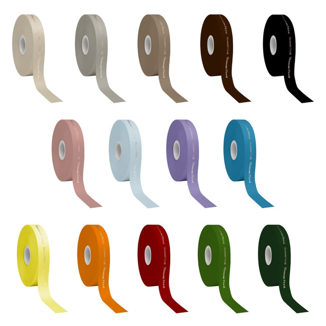 A collection of satin polyester ribbons in various colours, including beige, pink, blue, purple, and green, each on a roll.