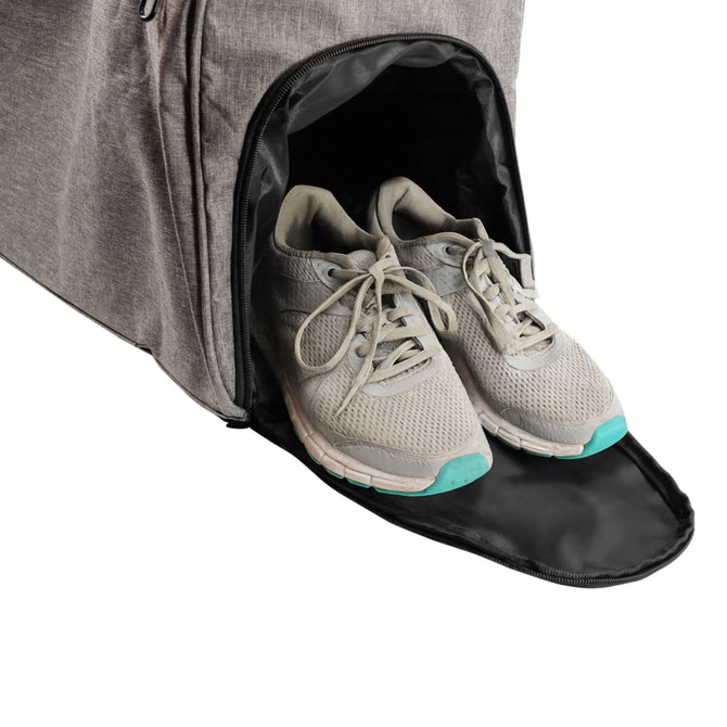 A grey wheeled duffel bag with a side compartment showcasing a pair of light grey athletic shoes.