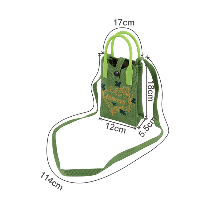 A green knitted phone crossbody bag with handles, featuring floral designs and an adjustable strap.