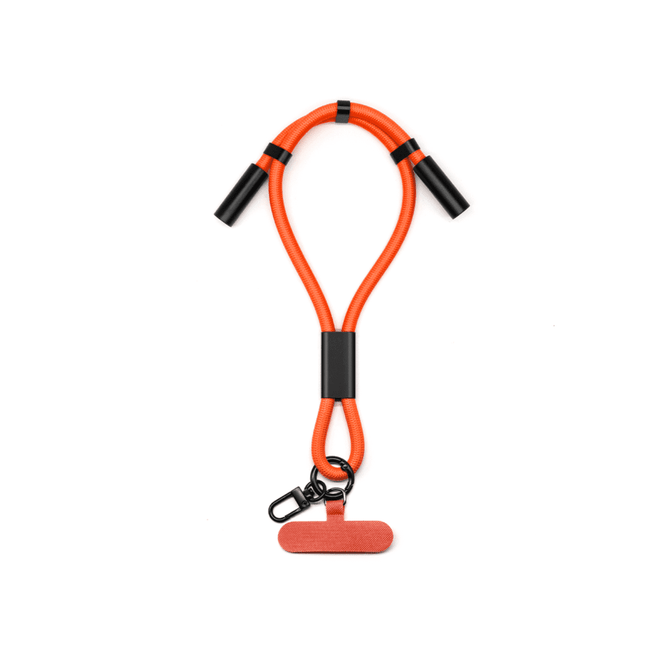 An orange charging phone strap with black connectors and a clip attachment.