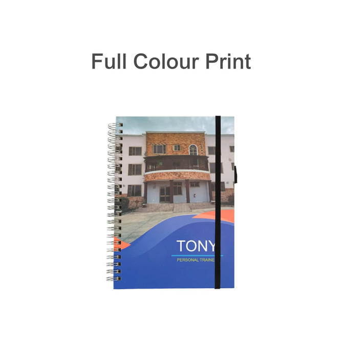A5 wiro-bound notebook with a colourful cover featuring a building design and a black elastic band.