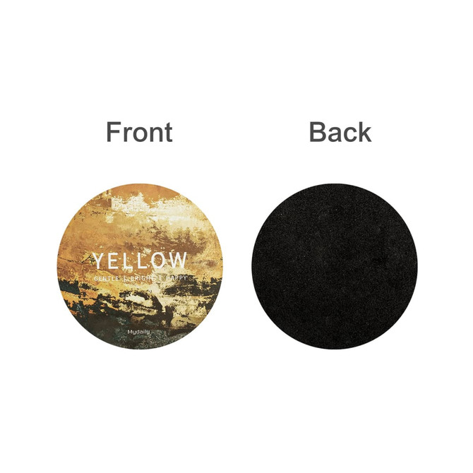 A round frosted metal coaster featuring a decorative front design in yellow tones and a plain black back.