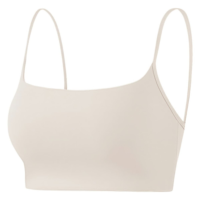 A seamless thin-strapped U-back crop bra tank in a light beige colour, featuring a simple design and no visible branding.