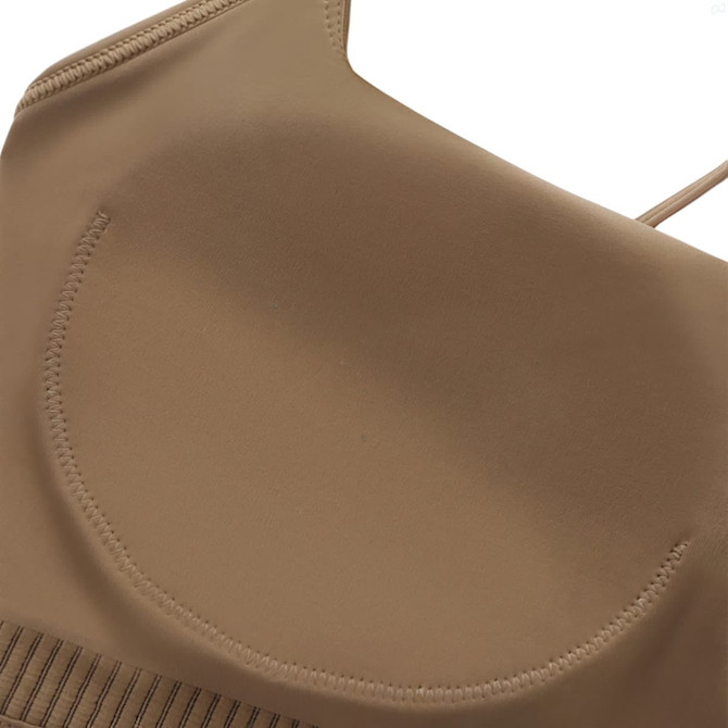 A women's seamless thin-strap U-back yoga crop bra tank in a tan colour with a smooth finish and tailored design.