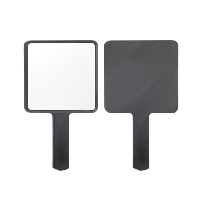 A handheld square mirror with a black handle and a reflective surface on one side and matte black on the other.