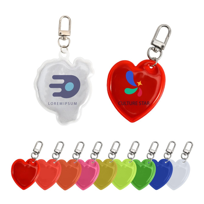 A selection of custom-shaped reflective keychains in various colours, featuring different logos and a metal clip.