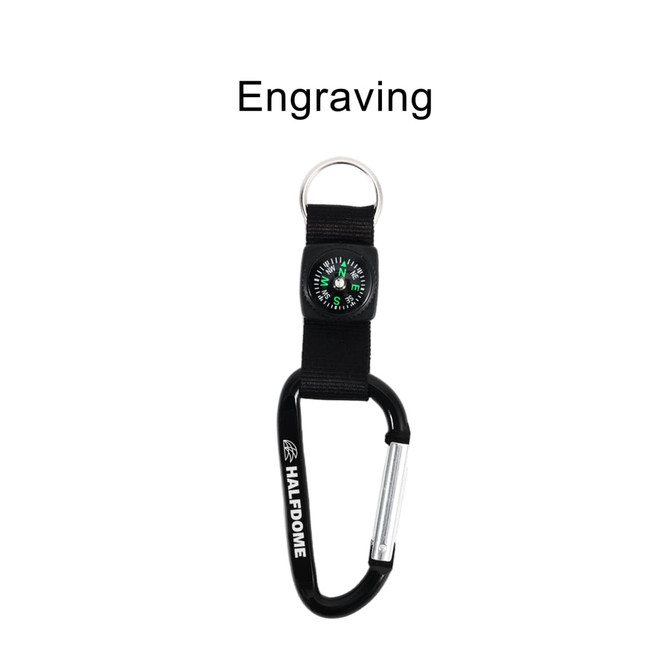 A black carabiner keychain with a compass attached, featuring a simple design. It has a logo and space for engraving.