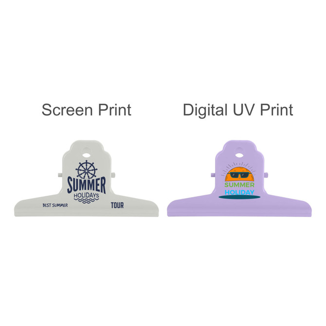 Two metal binder clips in white and purple featuring prints of "Summer Holidays" designs. Both clips have logos.