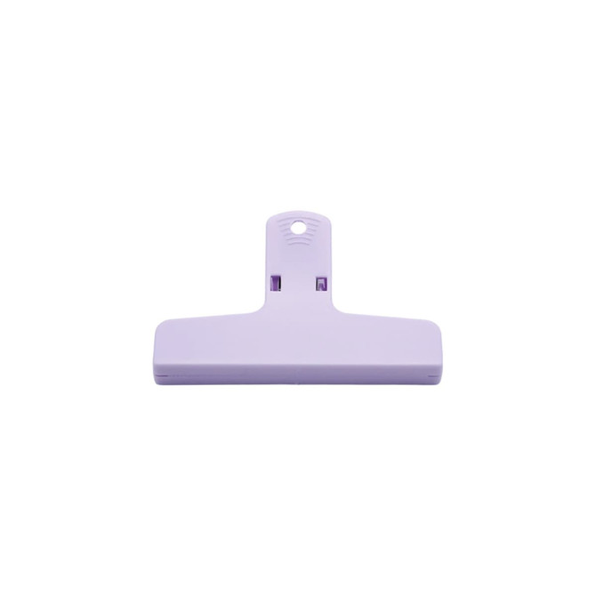 A purple plastic magnetic clip with a flat base and a loop for hanging. It features a logo on the surface.