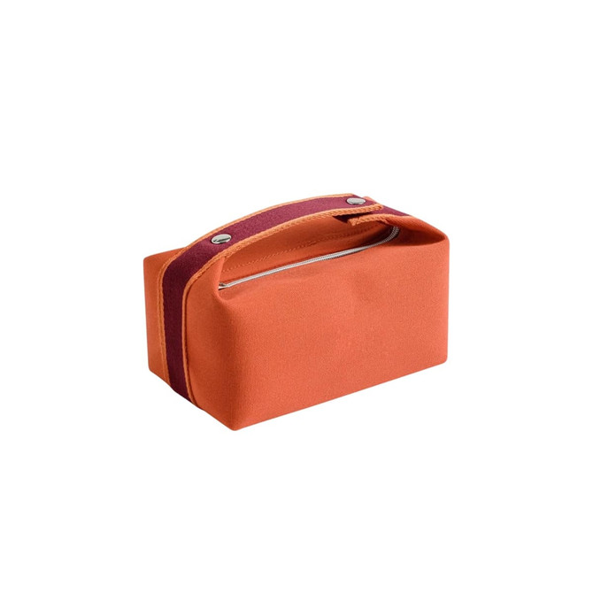 An orange portable canvas cosmetic bag with a maroon strap and a zip closure. It features a simple, rectangular design.