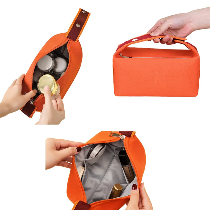 An orange portable canvas cosmetic bag with a zipper, featuring various containers inside and a handle for easy carry.