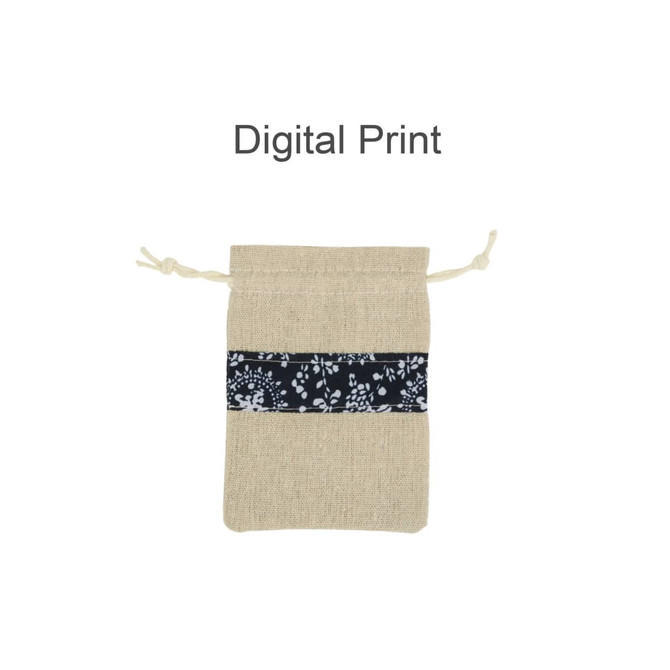 A beige drawstring bag featuring a navy floral patchwork band and a branded logo.