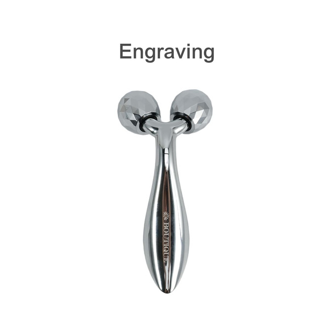 A chrome facial roller with two faceted balls and a sleek handle, featuring a logo.