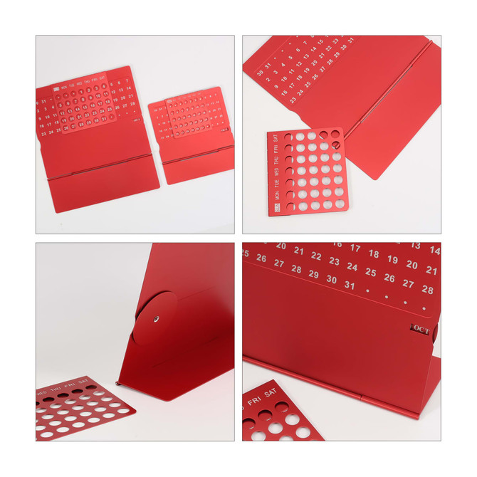 A red aluminium desk calendar featuring removable date panels and a sleek design. Includes a logo.