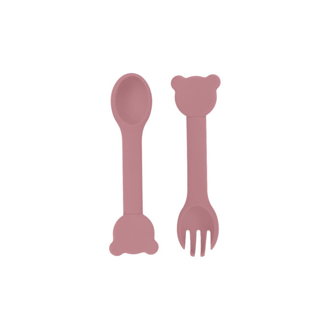 A bear-shaped silicone kids cutlery set in soft pink, featuring a spoon and fork with bear-shaped ends.