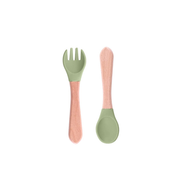 Ergonomic silicone kids cutlery set featuring a green fork and spoon with wooden handles. Includes a logo.