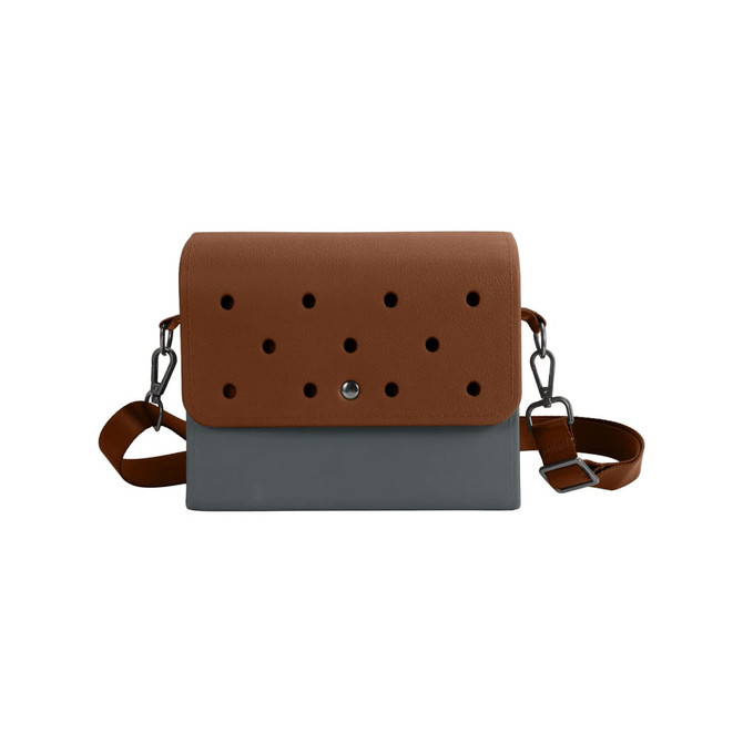 A briefcase with a brown top section featuring holes and a grey bottom, equipped with a shoulder strap.