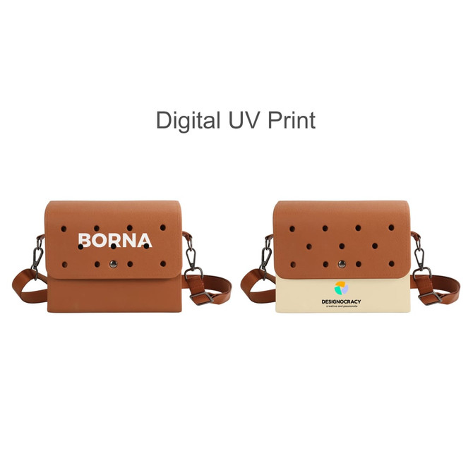 A brown briefcase with perforated details, featuring a strap and a logo. It has a two-tone design in beige and brown.