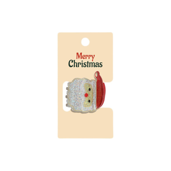 A festive hair claw featuring a glittery Santa design in white and red, presented on a card.