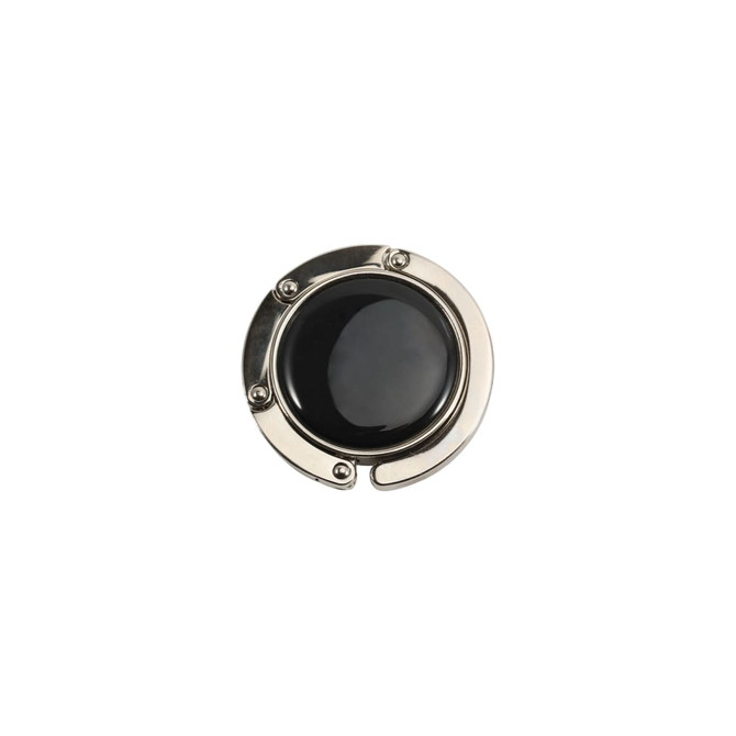 A round, foldable desk hook with a shiny silver metal frame and a black centre. It features a logo on the surface.