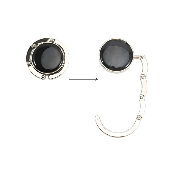 A round foldable desk hook in silver and black, featuring a sleek design and a pivoting arm.