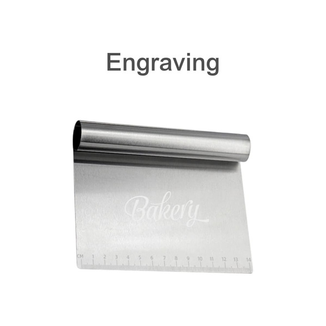 A stainless steel flour cutter with measurements along one edge, featuring a simple engraved design and a small logo.