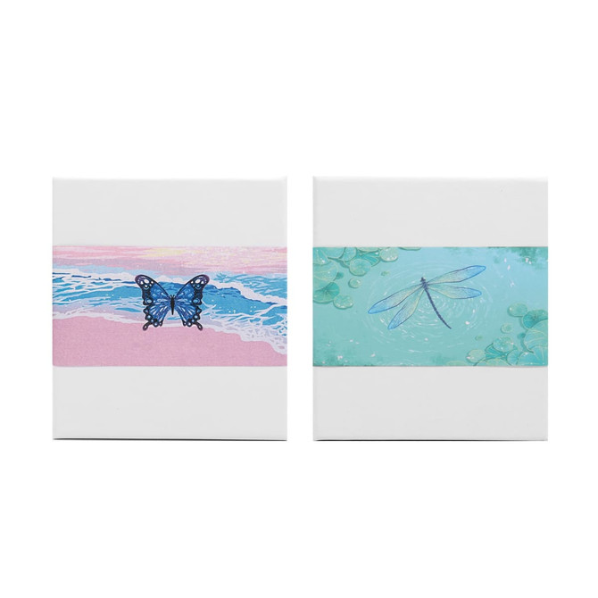 A 3D paper-cut sculpture notepad featuring a butterfly and a dragonfly design on pastel backgrounds. Each has a hanging loop.