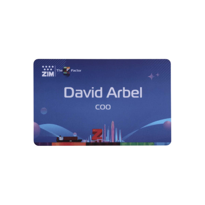 A custom PVC name badge in blue with a branding logo, featuring a design and text for an individual's name and title.