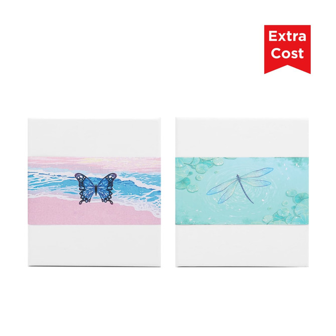 Two decorative notepads featuring a blue butterfly on a pink beach scene and a dragonfly on a green water background.