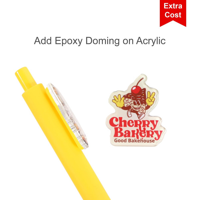 A yellow acrylic pen with a round top and a logo featuring a cherry on a bakery theme.