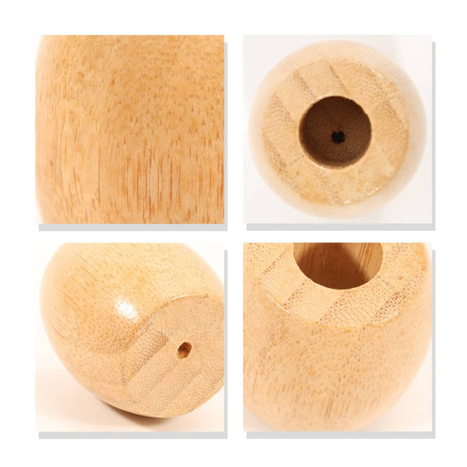 A bamboo toothbrush stand featuring a smooth, natural finish and rounded design. It has a small hole for toothbrush placement.