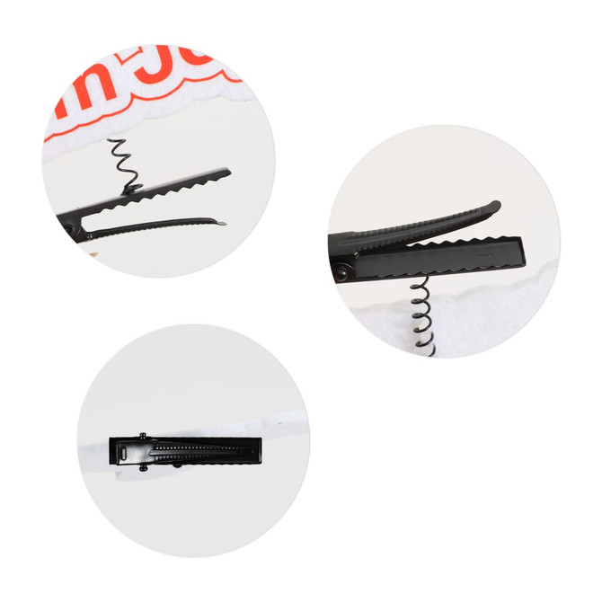 A custom felt spring hair clip in black, featuring a spiral design and textured gripping surfaces.